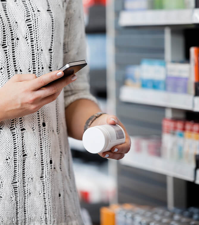 scanning medication in pharmacy with phone