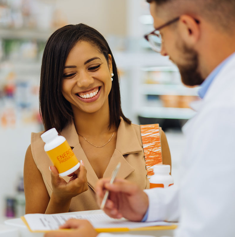 pharmacist talking to customer about nutraceuticals